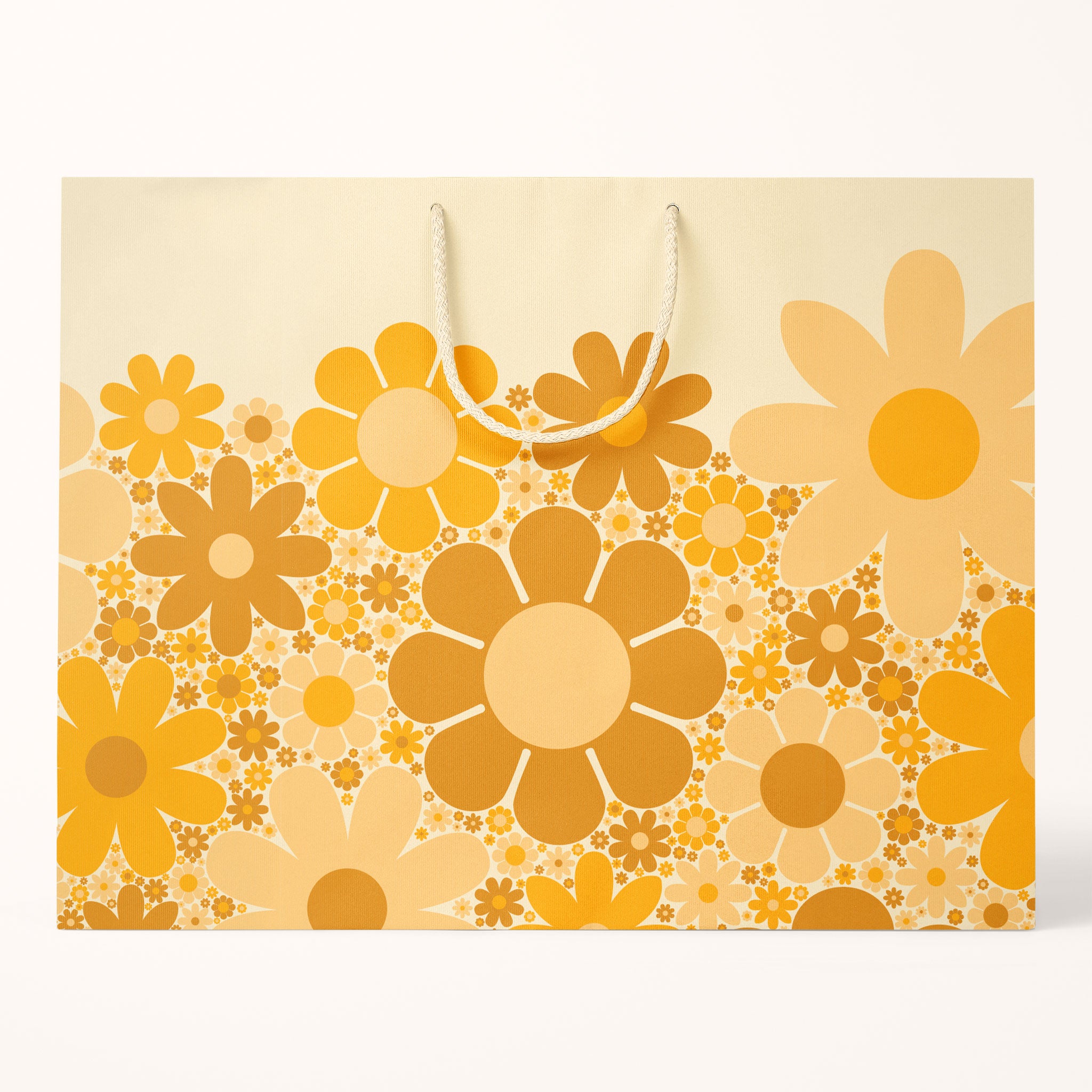 A light yellow gift bag with various daisies in different colors and sizes.